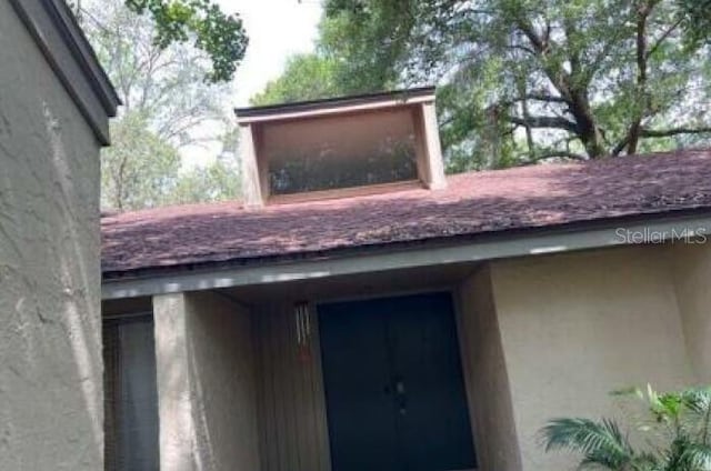 113 Red Cedar Dr, Longwood, FL 32779 - exterior view of stucco siding and roof with shingles