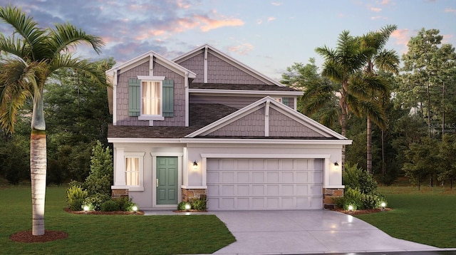 7898 Poplin St, Kissimmee, FL 34747 - craftsman house with a lawn, driveway, stone siding, roof with shingles, and a garage