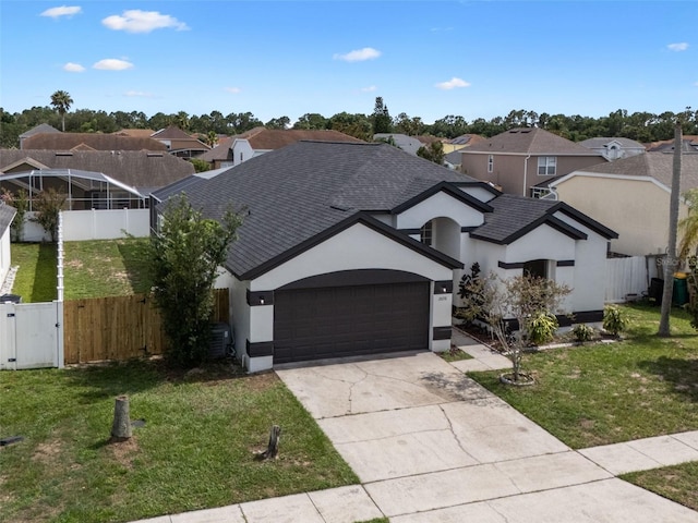 2898 Picadilly Cir, Kissimmee, FL 34747 - view of front of property featuring a gate, a shingled roof, a garage, stucco siding, and driveway
