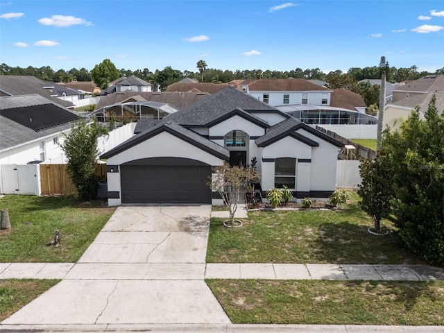2898 Picadilly Cir, Kissimmee, FL 34747 - view of front of property with a residential view, driveway, and stucco siding