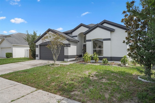 2898 Picadilly Cir, Kissimmee, FL 34747 - view of front facade with stucco siding, a garage, driveway, and a front lawn