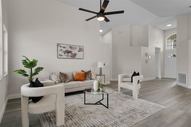 2898 Picadilly Cir, Kissimmee, FL 34747 - living room featuring a ceiling fan, wood finished floors, high vaulted ceiling, and recessed lighting