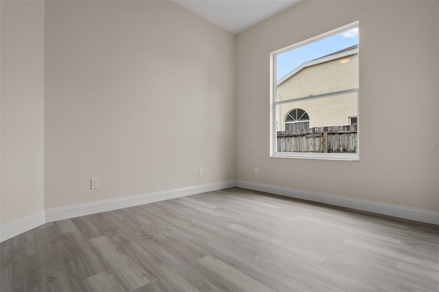 2898 Picadilly Cir, Kissimmee, FL 34747 - empty room featuring wood finished floors and baseboards
