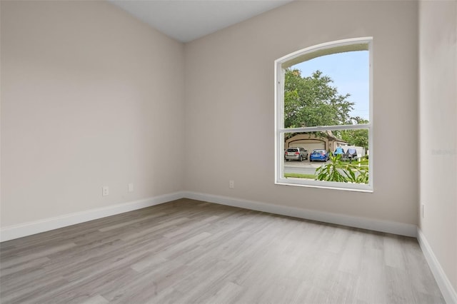 2898 Picadilly Cir, Kissimmee, FL 34747 - empty room with wood finished floors and baseboards