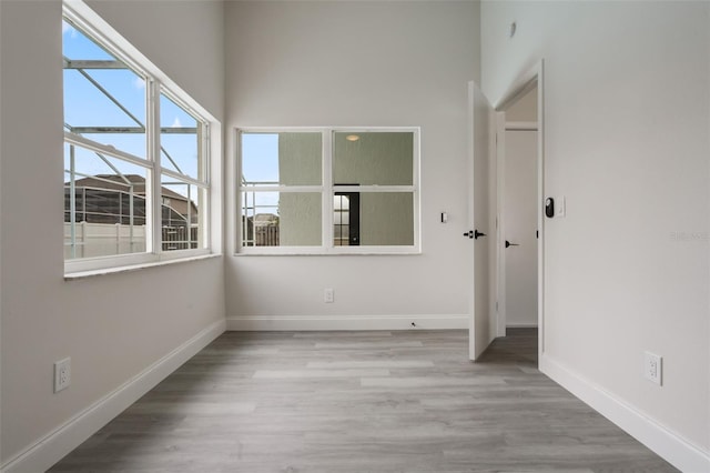 2898 Picadilly Cir, Kissimmee, FL 34747 - spare room with baseboards and wood finished floors