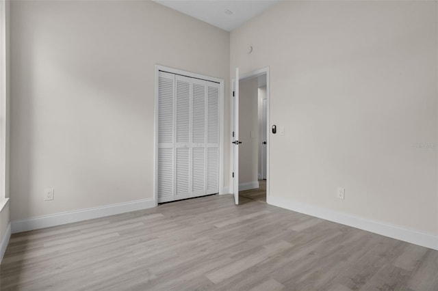 2898 Picadilly Cir, Kissimmee, FL 34747 - unfurnished bedroom with light wood finished floors and a closet