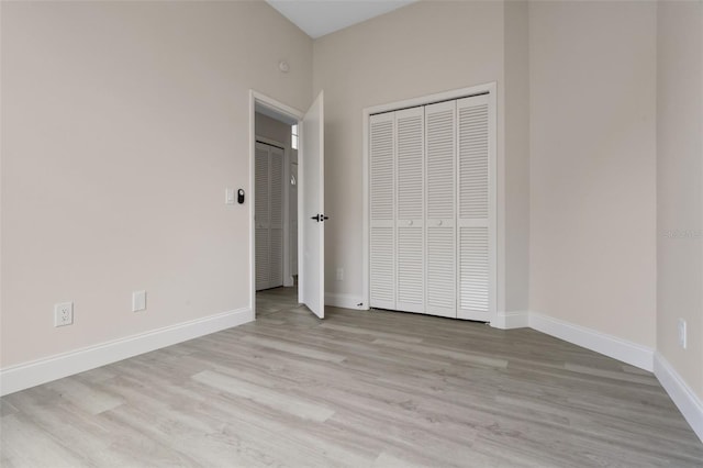 2898 Picadilly Cir, Kissimmee, FL 34747 - unfurnished bedroom with wood finished floors and a closet