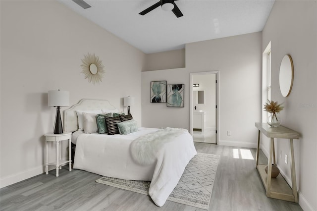 2898 Picadilly Cir, Kissimmee, FL 34747 - bedroom featuring light wood-type flooring, ensuite bathroom, and a ceiling fan