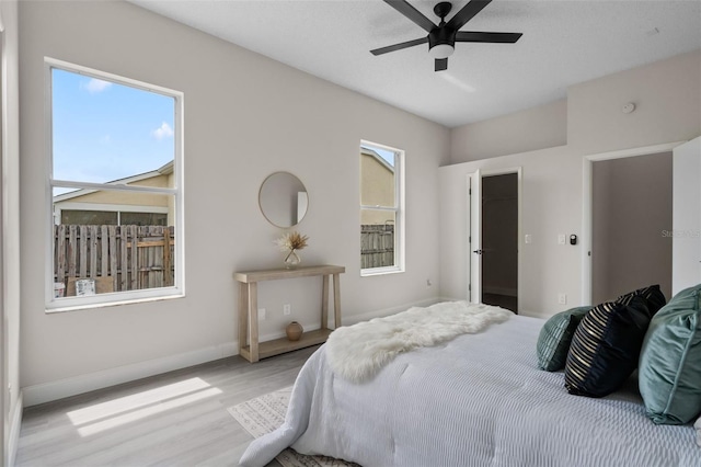 2898 Picadilly Cir, Kissimmee, FL 34747 - bedroom with wood finished floors and ceiling fan
