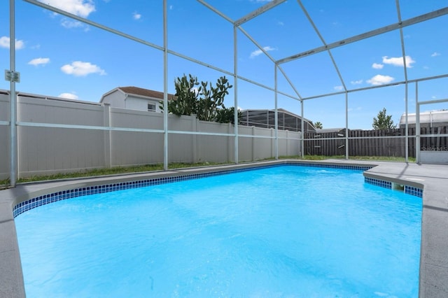 2898 Picadilly Cir, Kissimmee, FL 34747 - view of pool featuring glass enclosure and a patio area