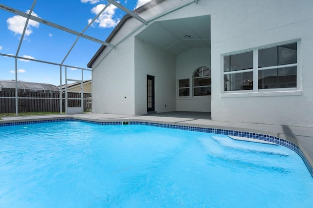 2898 Picadilly Cir, Kissimmee, FL 34747 - view of swimming pool with a patio area and glass enclosure