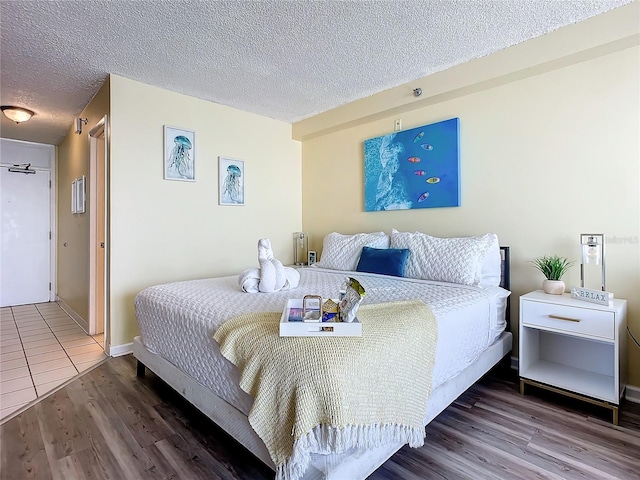 701 S Atlantic Ave Unit 504, Daytona Beach, FL 32118 - bedroom featuring wood finished floors and a textured ceiling