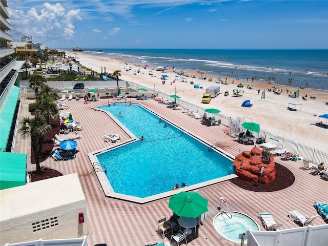 701 S Atlantic Ave Unit 504, Daytona Beach, FL 32118 - community pool with view of water and beach and a patio