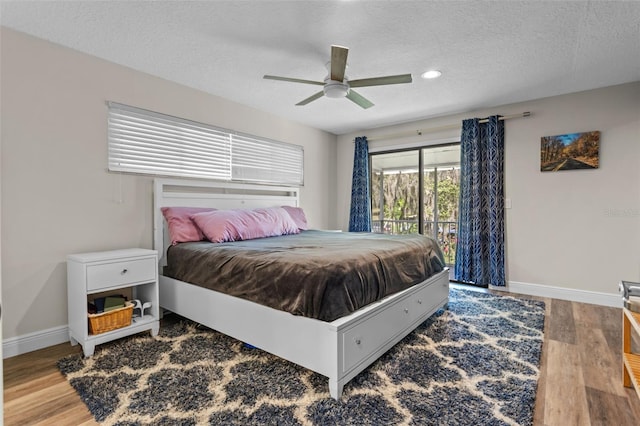 11815 Lake Susan, Clermont, FL 34711 - bedroom featuring access to outside, wood finished floors, a textured ceiling, ceiling fan, and recessed lighting