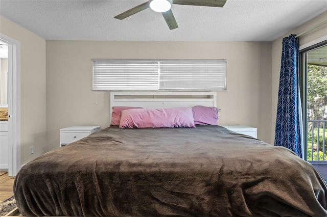 11815 Lake Susan, Clermont, FL 34711 - bedroom with a textured ceiling, a ceiling fan, access to exterior, and wood finished floors