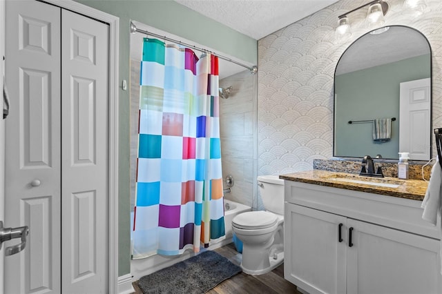 11815 Lake Susan, Clermont, FL 34711 - bathroom featuring a textured ceiling, vanity, shower / bath combo, and wood finished floors