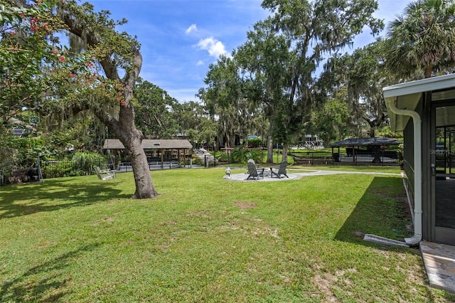 11815 Lake Susan, Clermont, FL 34711 - view of green lawn featuring a gazebo, view of wooded area, and an outdoor fire pit