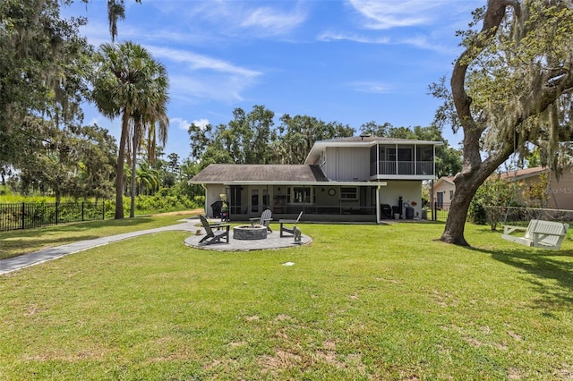 11815 Lake Susan, Clermont, FL 34711 - back of house with a fire pit, a sunroom, a patio, and driveway