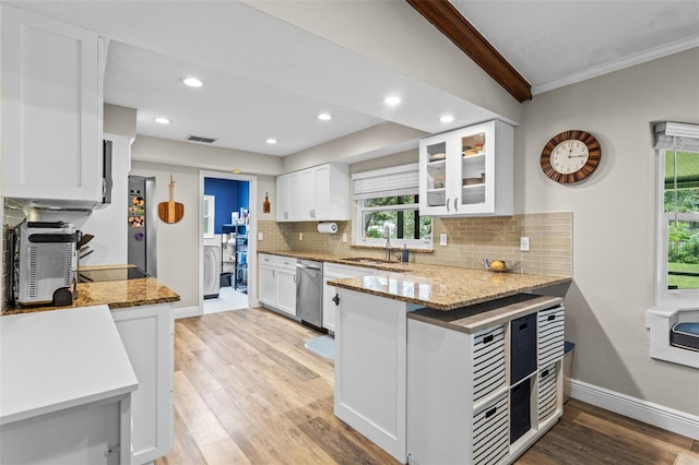 11815 Lake Susan, Clermont, FL 34711 - kitchen with appliances with stainless steel finishes, backsplash, white cabinets, light wood-style floors, and crown molding