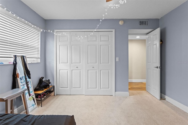 11815 Lake Susan, Clermont, FL 34711 - carpeted bedroom with a closet and baseboards