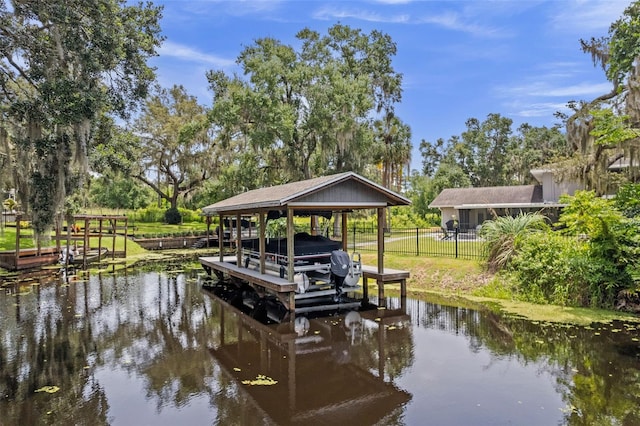 11815 Lake Susan, Clermont, FL 34711 - dock area with boat lift, a water view, and view of wooded area
