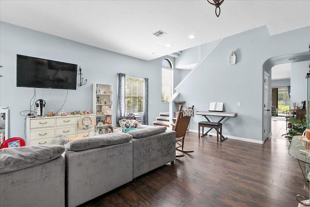 523 Lake Davenport Cir, Davenport, FL 33837 - living area with wood finished floors, recessed lighting, and arched walkways