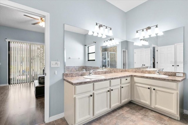 523 Lake Davenport Cir, Davenport, FL 33837 - full bathroom featuring a shower stall, double vanity, and ceiling fan