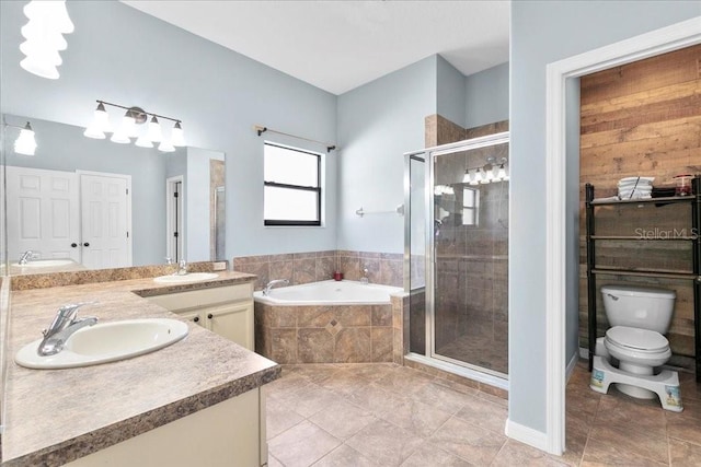 523 Lake Davenport Cir, Davenport, FL 33837 - bathroom with a bath, double vanity, a stall shower, and tile patterned flooring