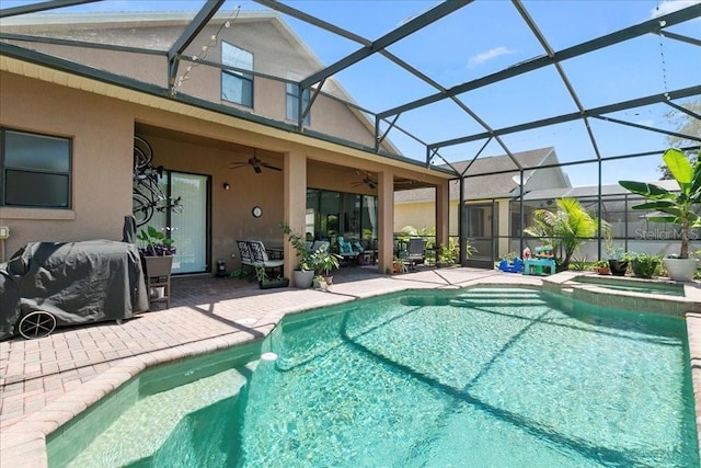 523 Lake Davenport Cir, Davenport, FL 33837 - view of pool with a patio area, ceiling fan, a pool with connected hot tub, and glass enclosure