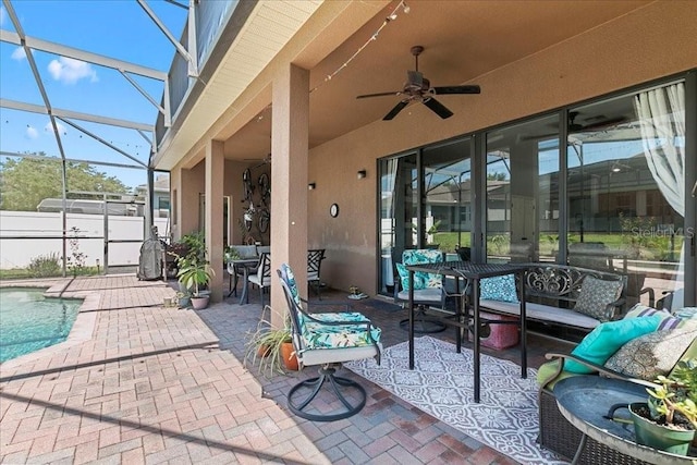 523 Lake Davenport Cir, Davenport, FL 33837 - view of patio with ceiling fan, an outdoor living space, a lanai, and outdoor dining area