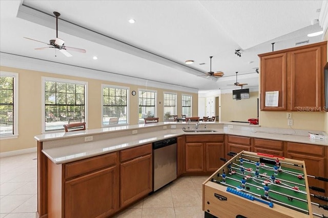 523 Lake Davenport Cir, Davenport, FL 33837 - kitchen featuring stainless steel dishwasher, a ceiling fan, light tile patterned floors, light countertops, and brown cabinets