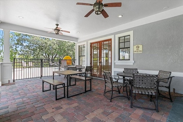 523 Lake Davenport Cir, Davenport, FL 33837 - view of patio / terrace with french doors, ceiling fan, and outdoor dining area