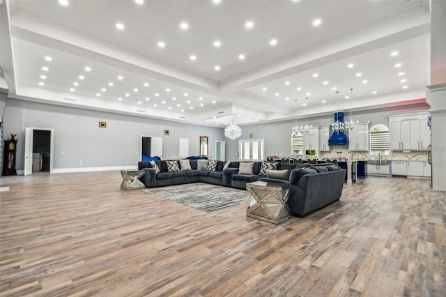 15715 Trousdale St, Clermont, FL 34715 - living area with a chandelier, light wood finished floors, recessed lighting, and plenty of natural light