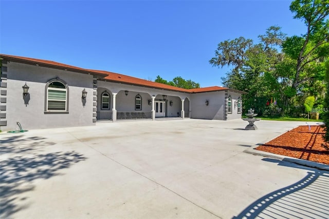 15715 Trousdale St, Clermont, FL 34715 - back of house with stucco siding