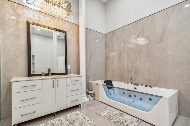 15715 Trousdale St, Clermont, FL 34715 - full bathroom with vanity, a tub with jets, tile walls, and a chandelier