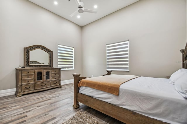 15715 Trousdale St, Clermont, FL 34715 - bedroom featuring wood finished floors, recessed lighting, a ceiling fan, and a towering ceiling
