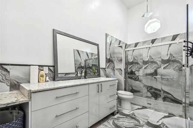 15715 Trousdale St, Clermont, FL 34715 - full bathroom featuring vanity, marble finish flooring, a marble finish shower, and tile walls