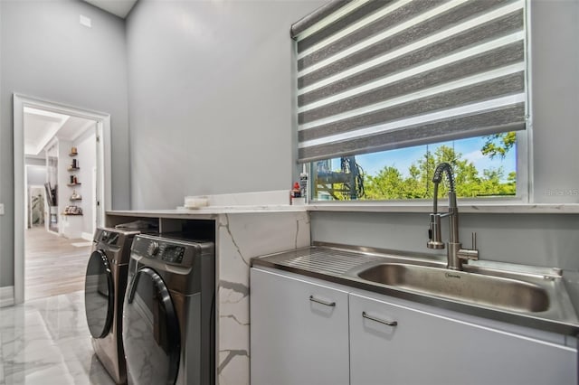 15715 Trousdale St, Clermont, FL 34715 - laundry area featuring separate washer and dryer and cabinet space