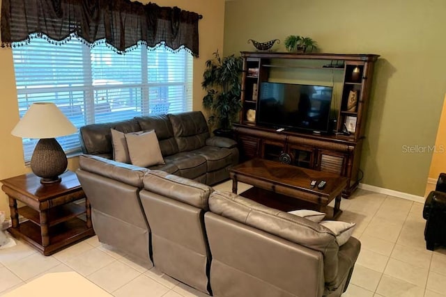7763 Tosteth St, Kissimmee, FL 34747 - living area with tile patterned flooring and baseboards