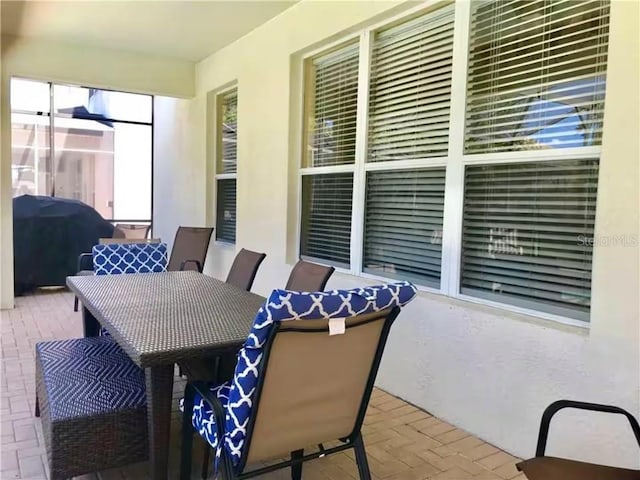 7763 Tosteth St, Kissimmee, FL 34747 - view of patio featuring grilling area and outdoor dining space