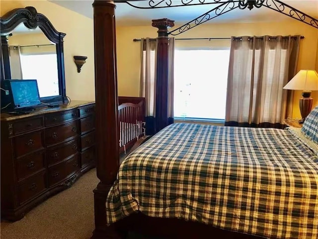 7763 Tosteth St, Kissimmee, FL 34747 - carpeted bedroom featuring multiple windows and decorative columns