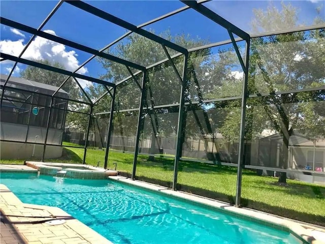 7763 Tosteth St, Kissimmee, FL 34747 - view of pool with a pool with connected hot tub and a lanai