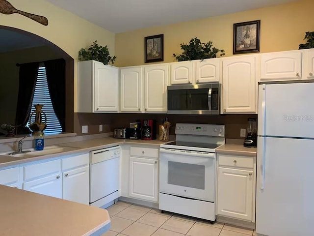 7763 Tosteth St, Kissimmee, FL 34747 - kitchen featuring white appliances and white cabinetry