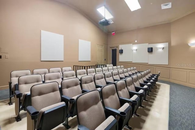7763 Tosteth St, Kissimmee, FL 34747 - carpeted cinema featuring vaulted ceiling and a decorative wall