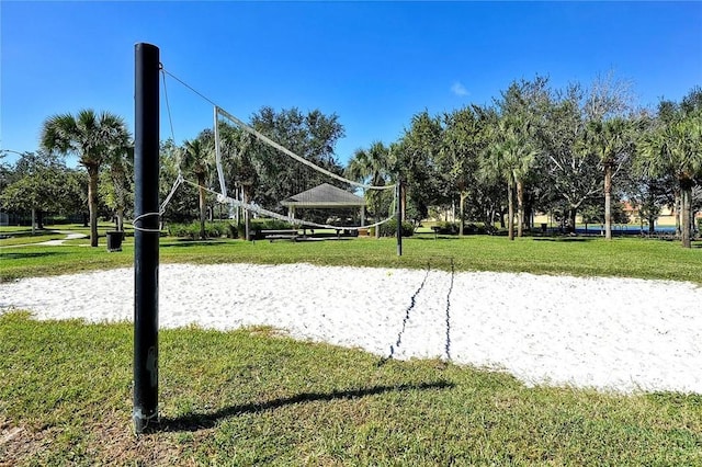 7763 Tosteth St, Kissimmee, FL 34747 - view of property's community featuring volleyball court and a lawn