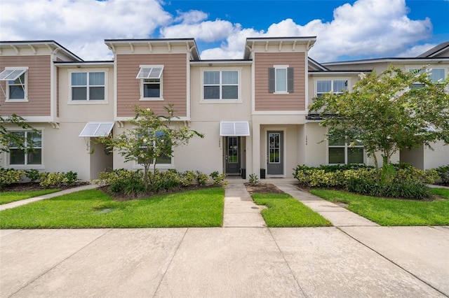 1660 Tropical Palms Cir, Kissimmee, FL 34747 - italianate house with stucco siding and a front yard