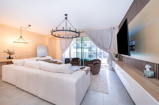 1660 Tropical Palms Cir, Kissimmee, FL 34747 - living area with a chandelier, light tile patterned flooring, and a decorative wall