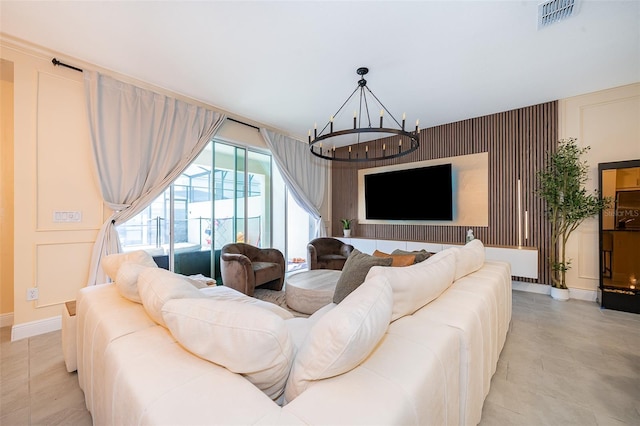 1660 Tropical Palms Cir, Kissimmee, FL 34747 - living area featuring a chandelier and an accent wall