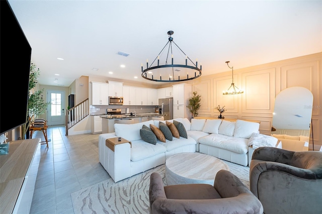 1660 Tropical Palms Cir, Kissimmee, FL 34747 - living area featuring a chandelier, recessed lighting, and light tile patterned floors