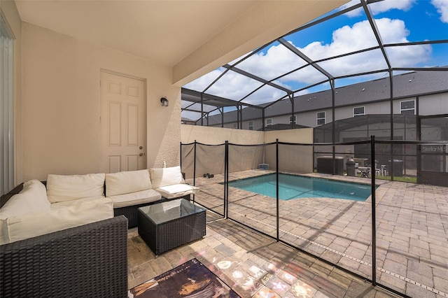 1660 Tropical Palms Cir, Kissimmee, FL 34747 - view of swimming pool featuring a patio area, an outdoor living space, and glass enclosure